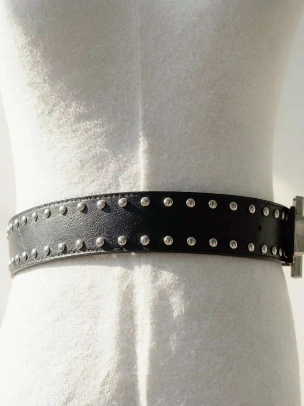 Y2K 2000s style Black leather studded cross belt with silver hardware